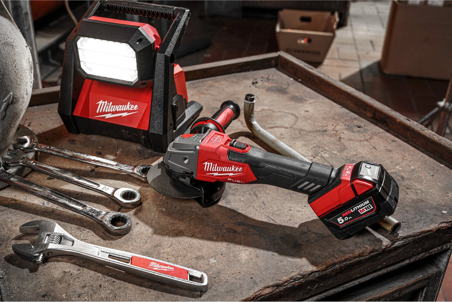 M18 125 mm angle grinder with brake and paddle switch + 2 × 5 Ah batteries + charger + Milwaukee case, M18 FSAG125XB-502X